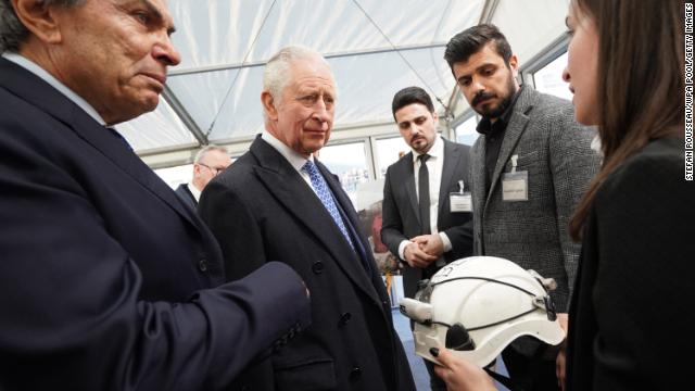 King Charles III is presented with a White Helmet from the Syria Civil Defence organisation as he talks with members of the Syrian diaspora community on Tuesday.