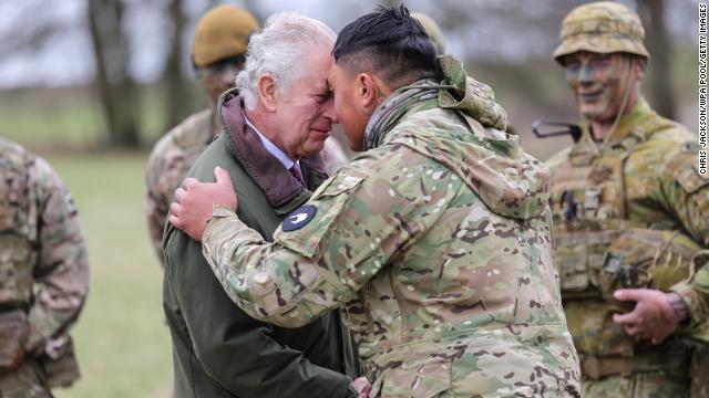 King Charles III receives the hongi, the traditional Maori greeting from a New Zealander who is part of the Ukrainian contingent training at the site on February 20, 2023 in Wiltshire, England.