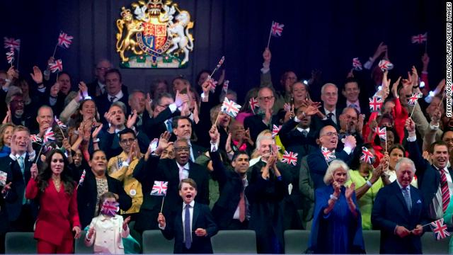 Members of the royal family cheer during the coronation concert on Sunday.