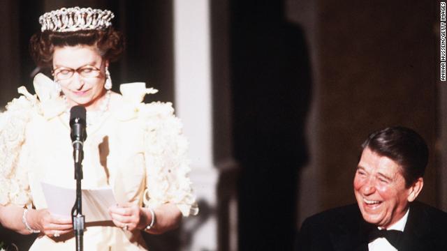 US President Ronald Reagan laughs as Queen Elizabeth II delivers a speech during a banquet in March 1983 in San Francisco, California. 