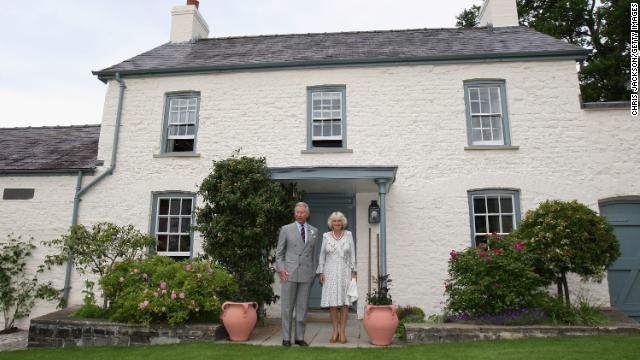 King Charles and Queen Camilla pose outside their Welsh property Llwynywermod in this file photograph before a drinks reception on 2019.