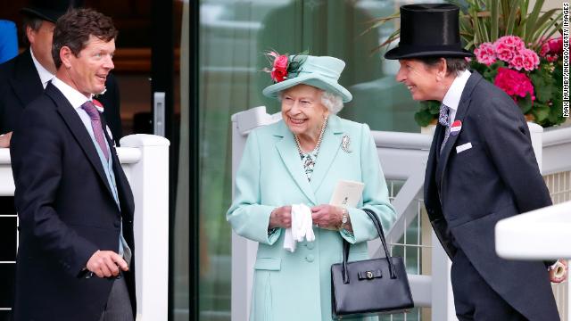 File photograph of the late Queen Elizabeth II enjoying a day at the races.