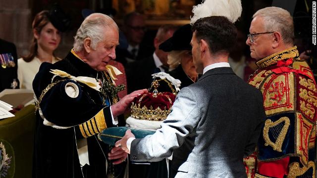 King Charles III is presented with the Crown of Scotland at St. Giles' Cathedral, Edinburgh on July 5, 2023.