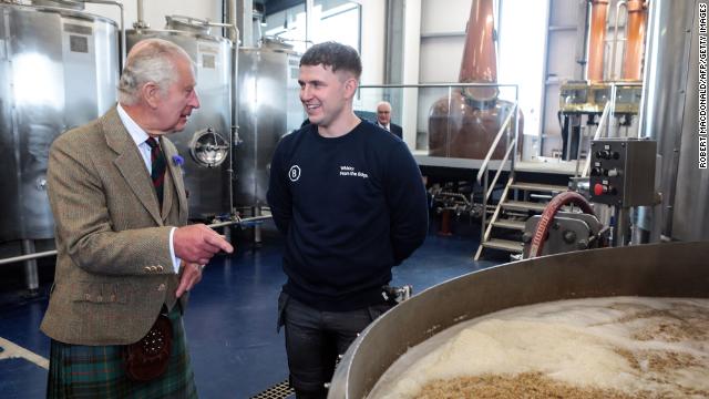 Britain's King Charles III (L) takes part in a visit of the 8 Doors Distillery in John O'Groats, Wick, in the Scottish Highlands, on August 2, 2023 