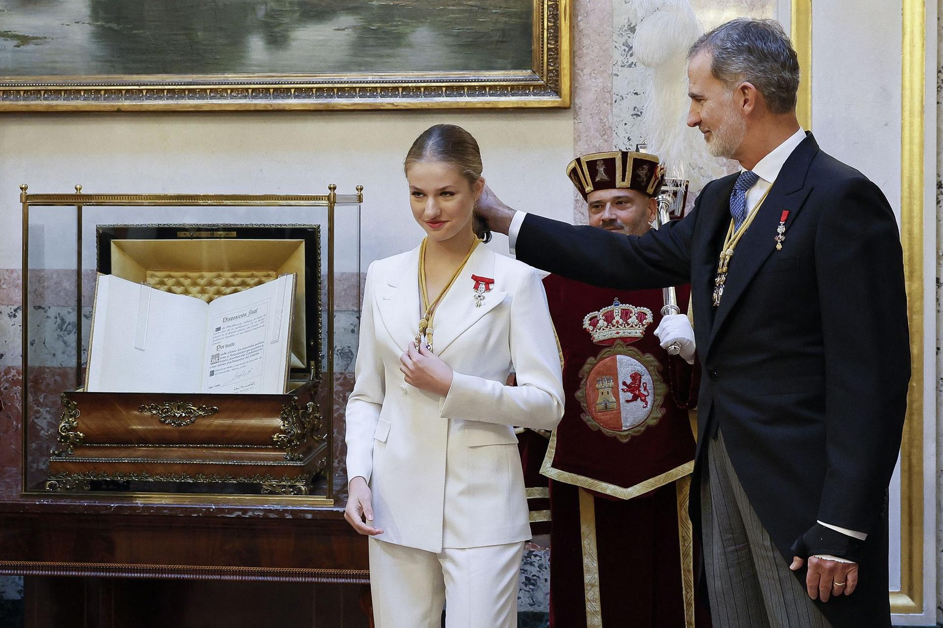 Spanish Crown Princess of Asturias Leonor (R) attends with Spain's King Felipe VI a ceremony to swear loyalty to the constitution, on her 18th birthday, at the Congress of Deputies in Madrid on Tuesday.