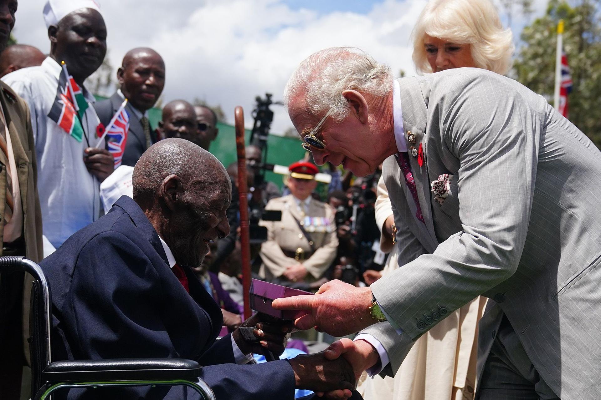 King Charles III and Queen Camilla meet veteran Samwel Nthigai Mburia, who is believed to be 117 years old, in Nairobi.
