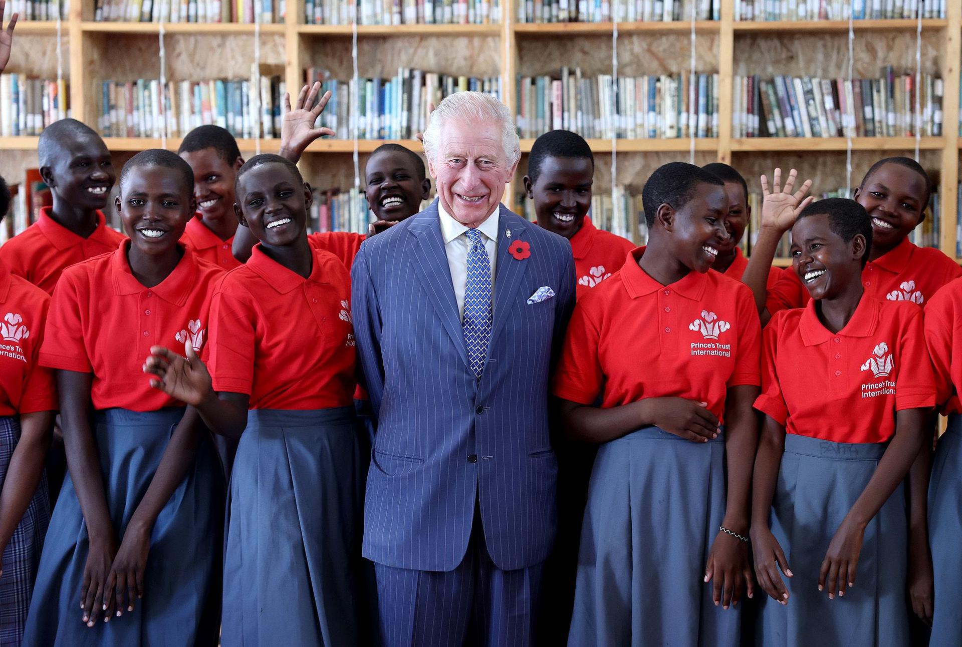 The King poses with students taking part in a Prince’s Trust International Enterprise Challenge on October 31 in Nairobi, Kenya.