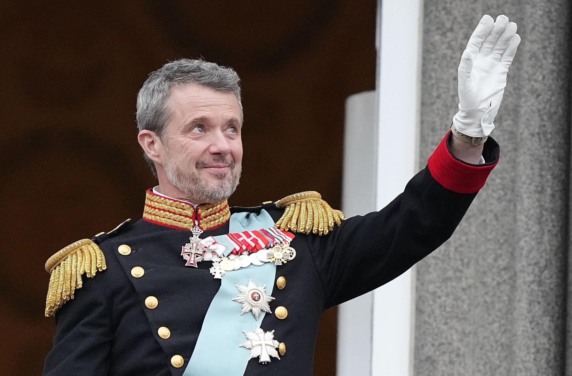 Denmark's King Frederik X waves from the balcony of Christiansborg Palace in Copenhagen, Denmark on Sunday. 