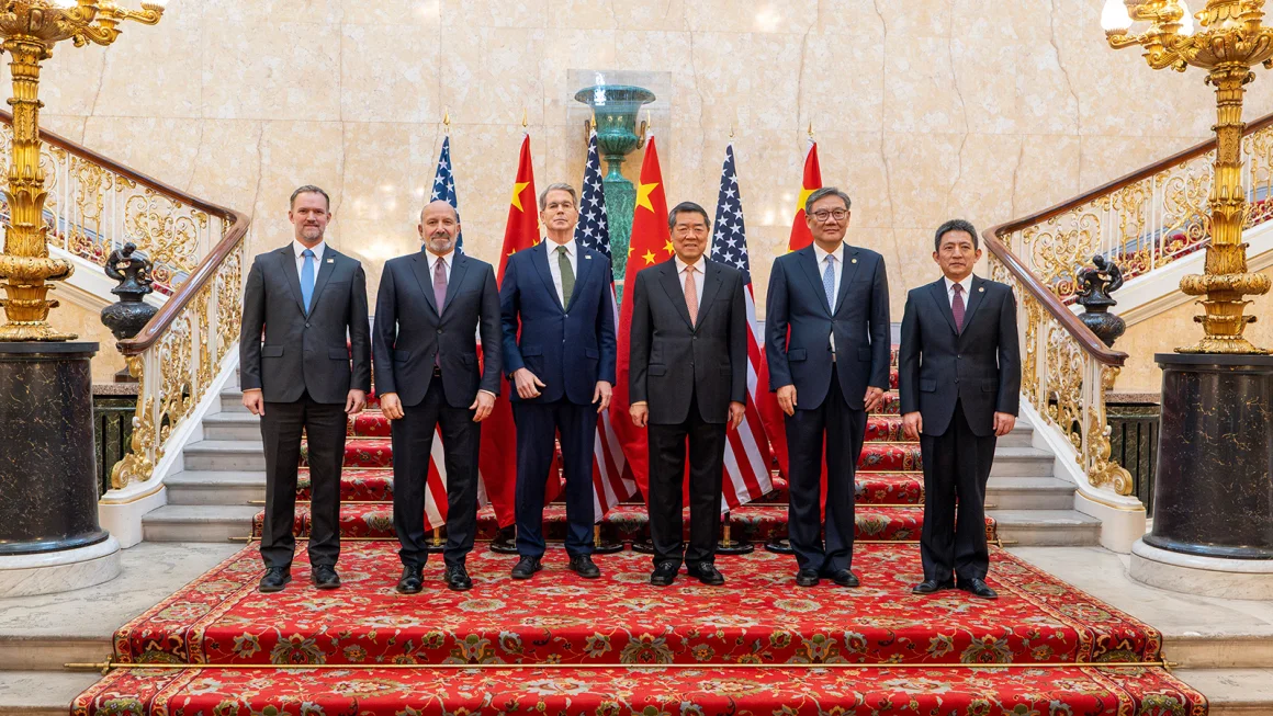 US and Chinese officials pose for a photo during trade discussions at Lancaster House in London on June 9. 