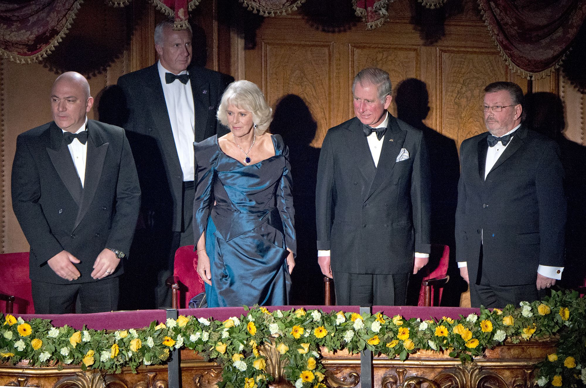 Charles and Camilla stand in the royal box for the national anthem as they attend the Royal Variety Performance at the London Palladium Theatre in 2013