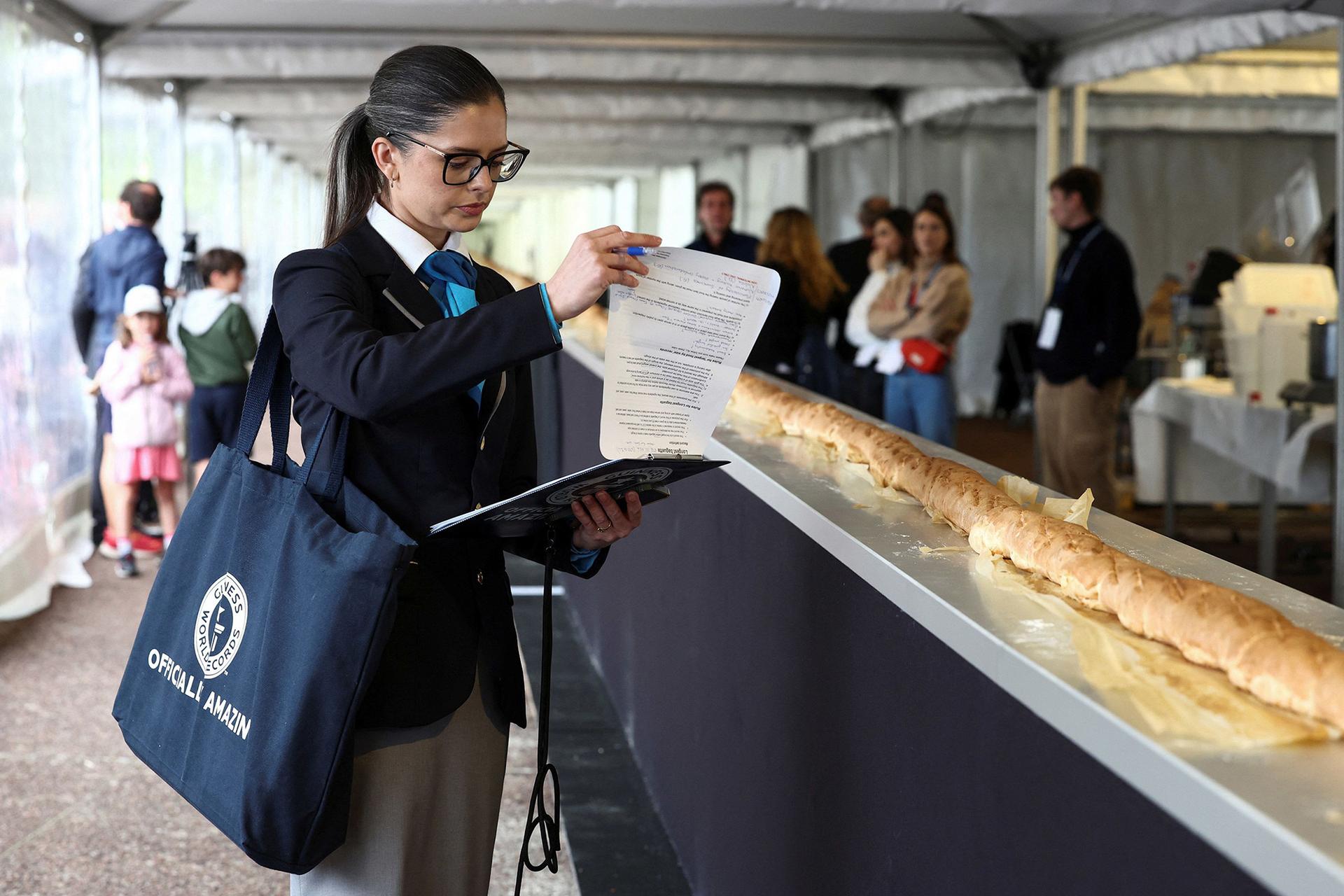Joanne Brent of Guinness World Records inspects baguette