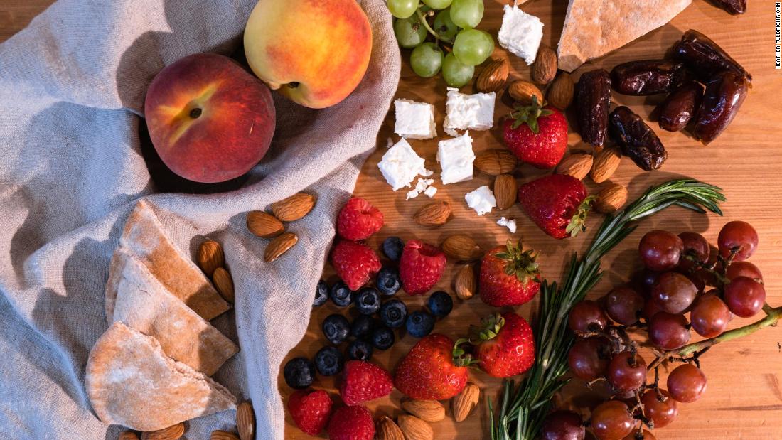 Meze of fruits, vegetables, pita bread and cheese