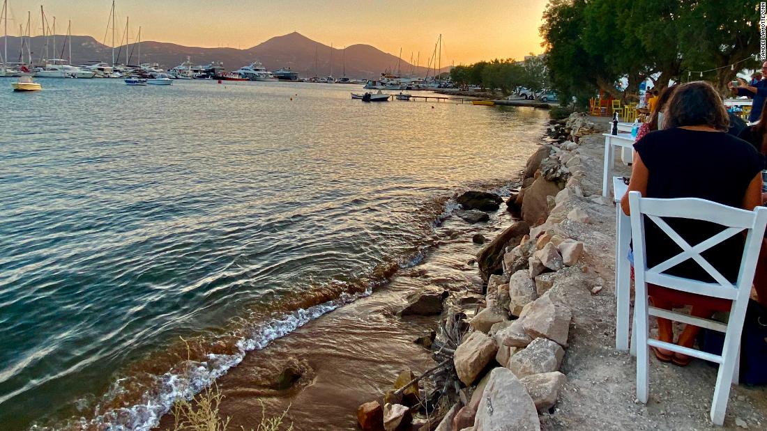 Sunset on the Greek coast at an open-air restaurant