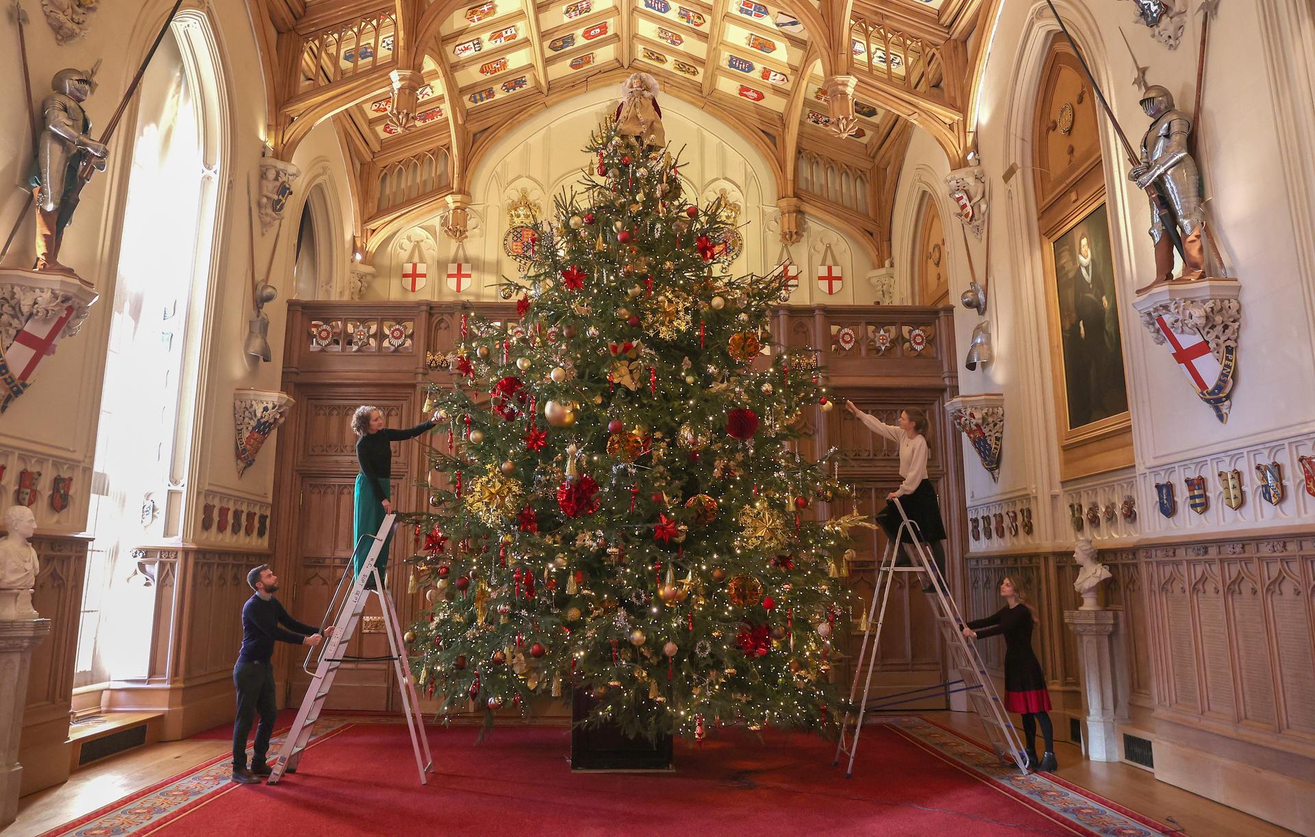 Finishing touches are made to a 20-foot-tall Christmas tree at Windsor Castle.