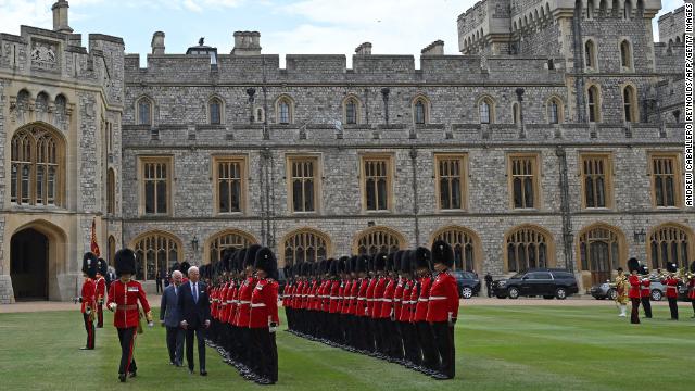 The pair inspect an honor guard formed by the Welsh Guards, during a ceremonial welcome in the Quadrangle at the royal residence.