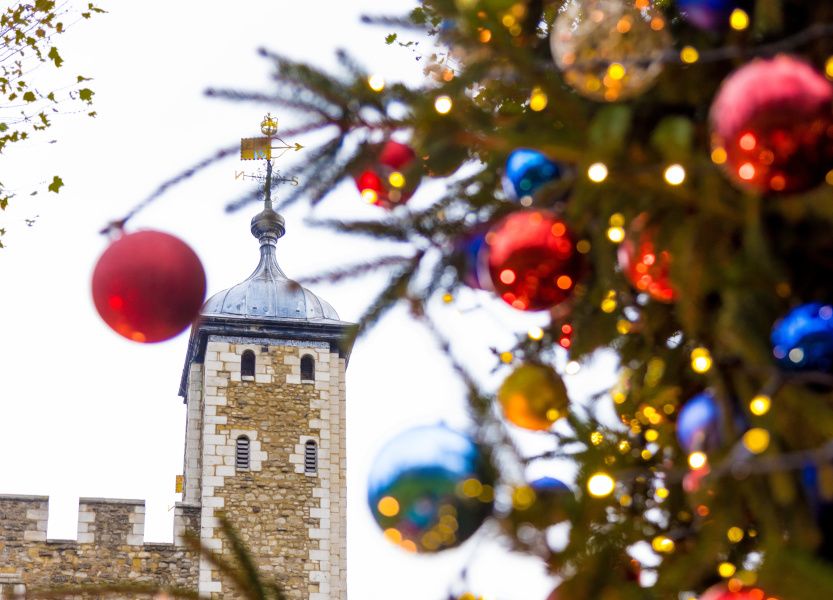 Brightly coloured baubles on a Christmas tree outside the Tower of London