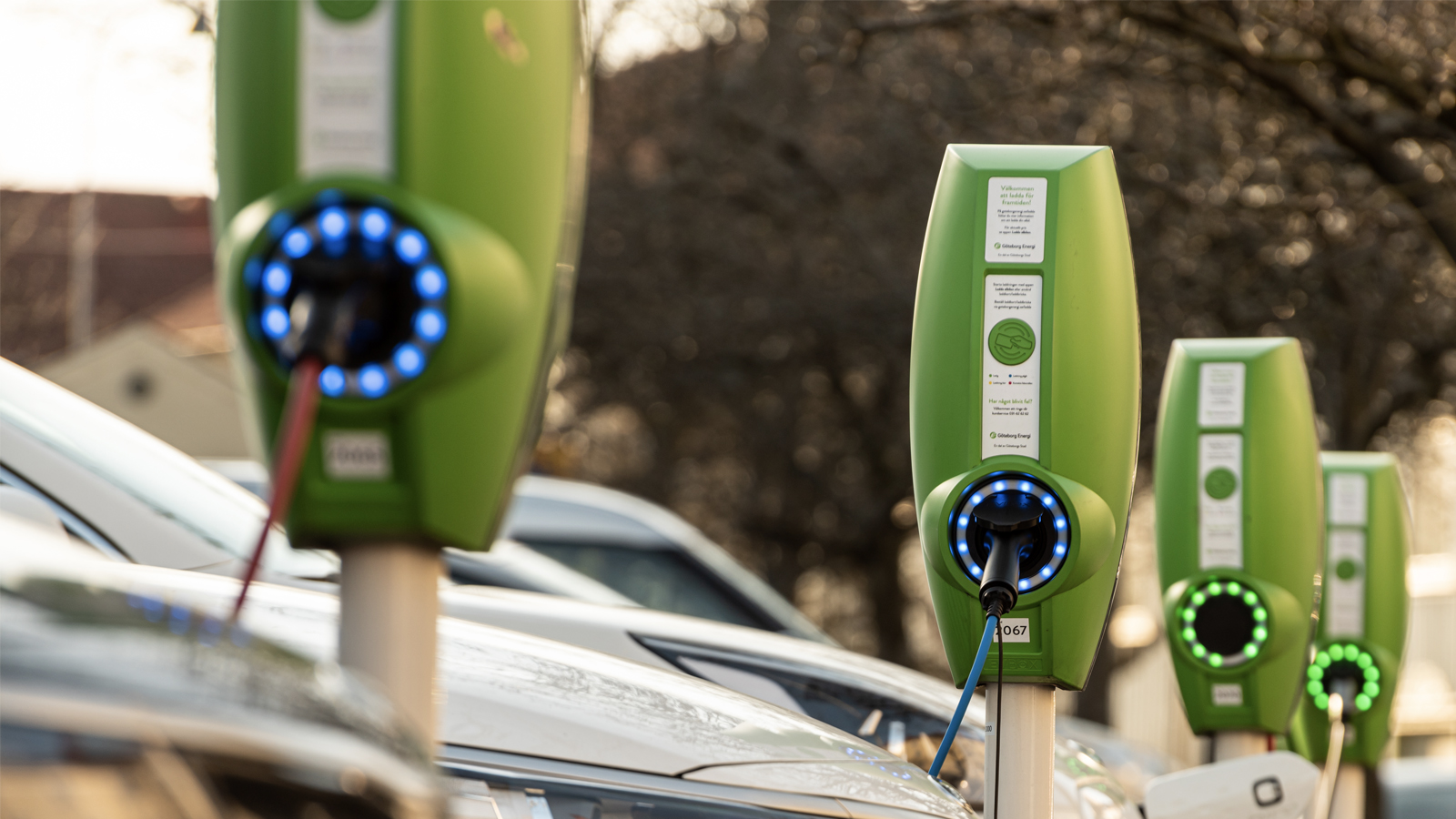 Electric and hybrid cars charging at public charging stations