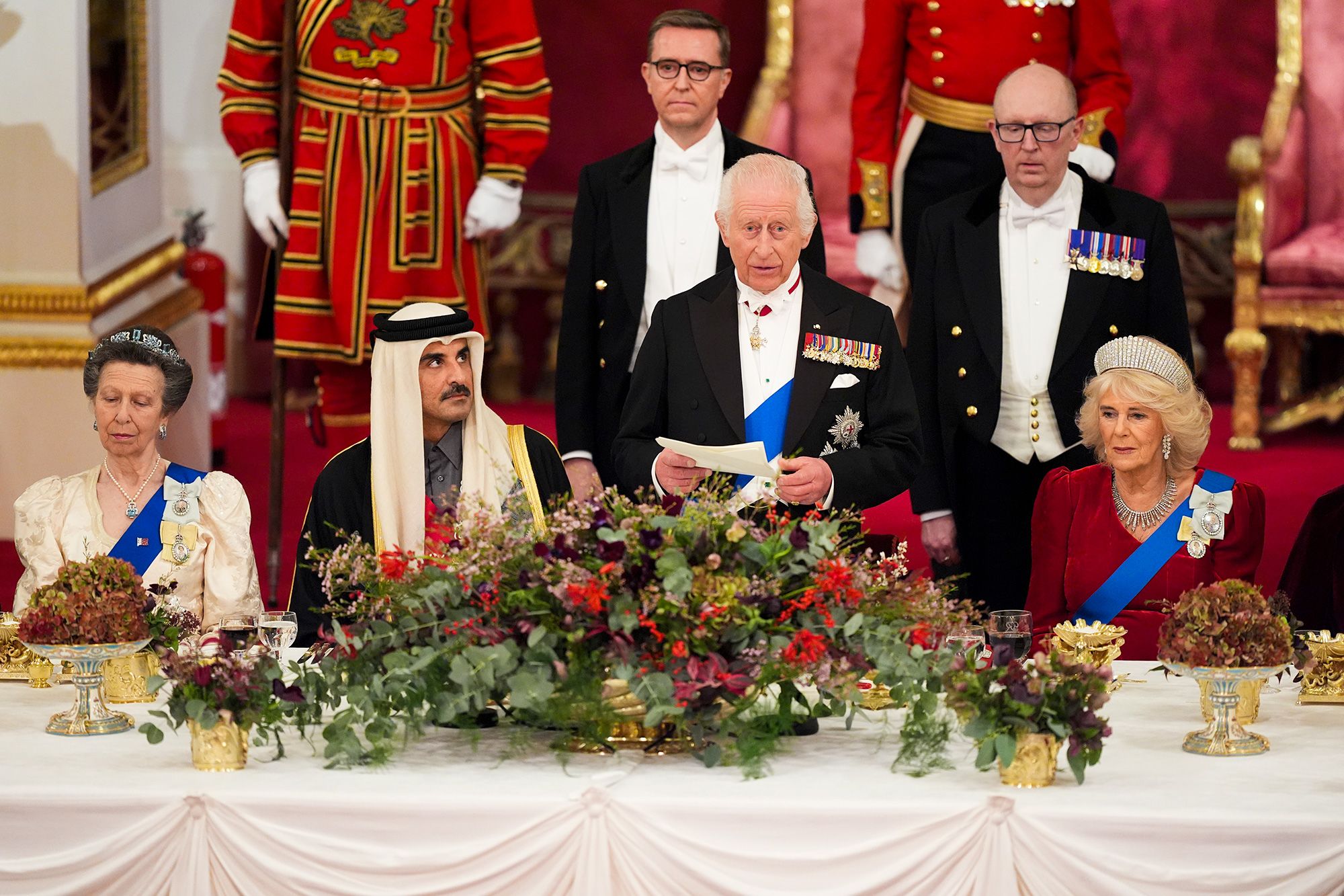 King Charles and Queen Camilla with the Emir of Qatar and Princess Anne during a State Banquet at Buckingham Palace on 3rd December 2024.