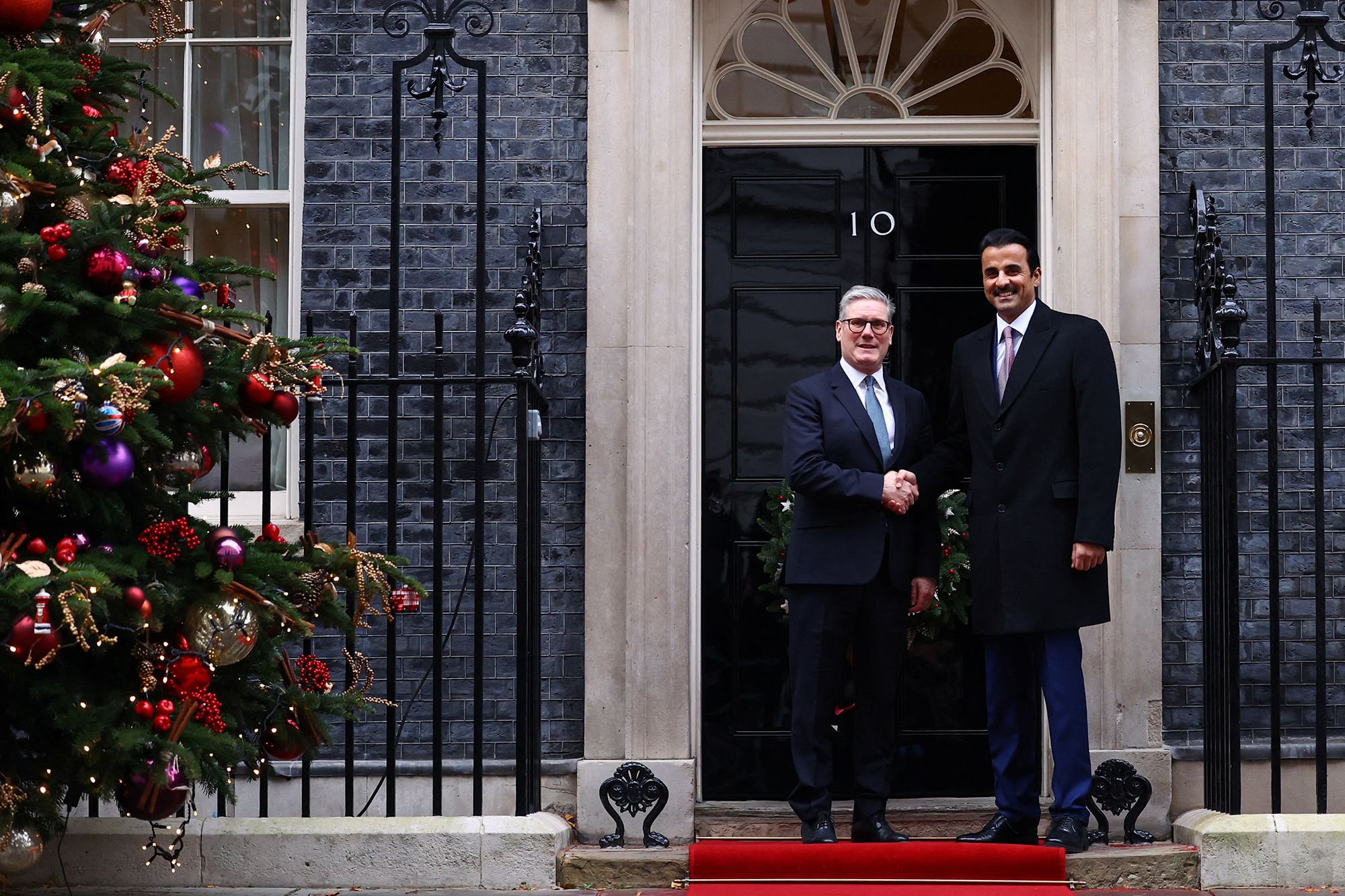 UK Prime Minister Keir Starmer shakes hands with the Emir of Qatar before a meeting at 10 Downing Street on 4th December 2024.