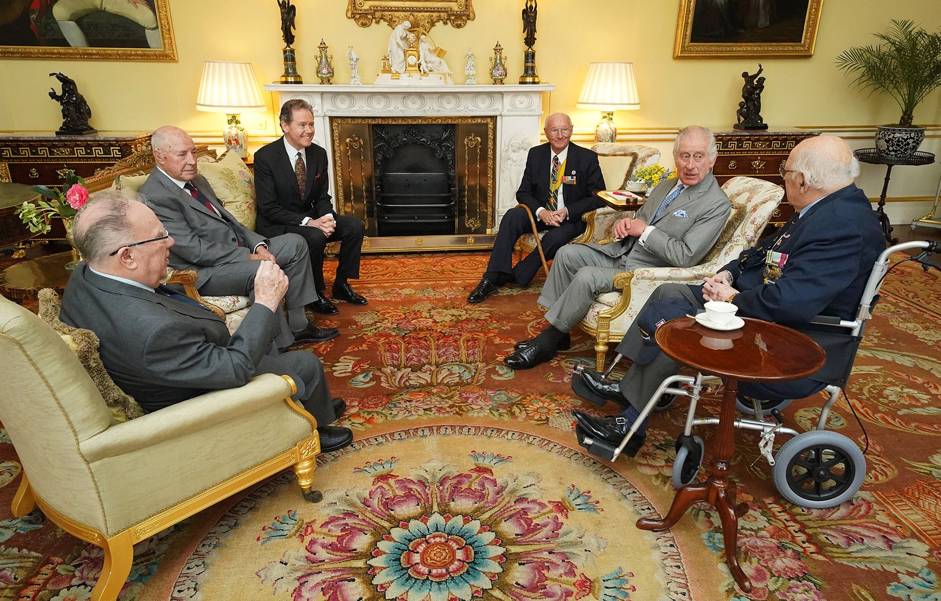 Britain's King Charles III chatting with Korean war veterans