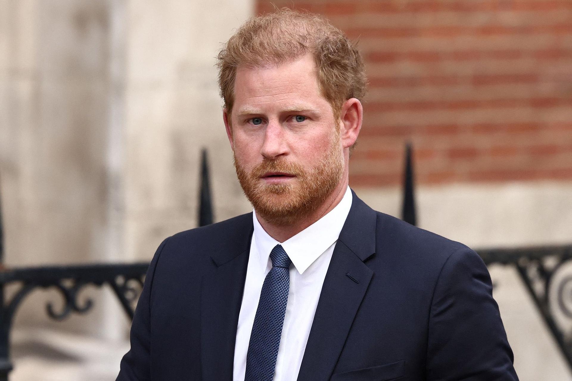 Prince Harry in a suit leaving court in March