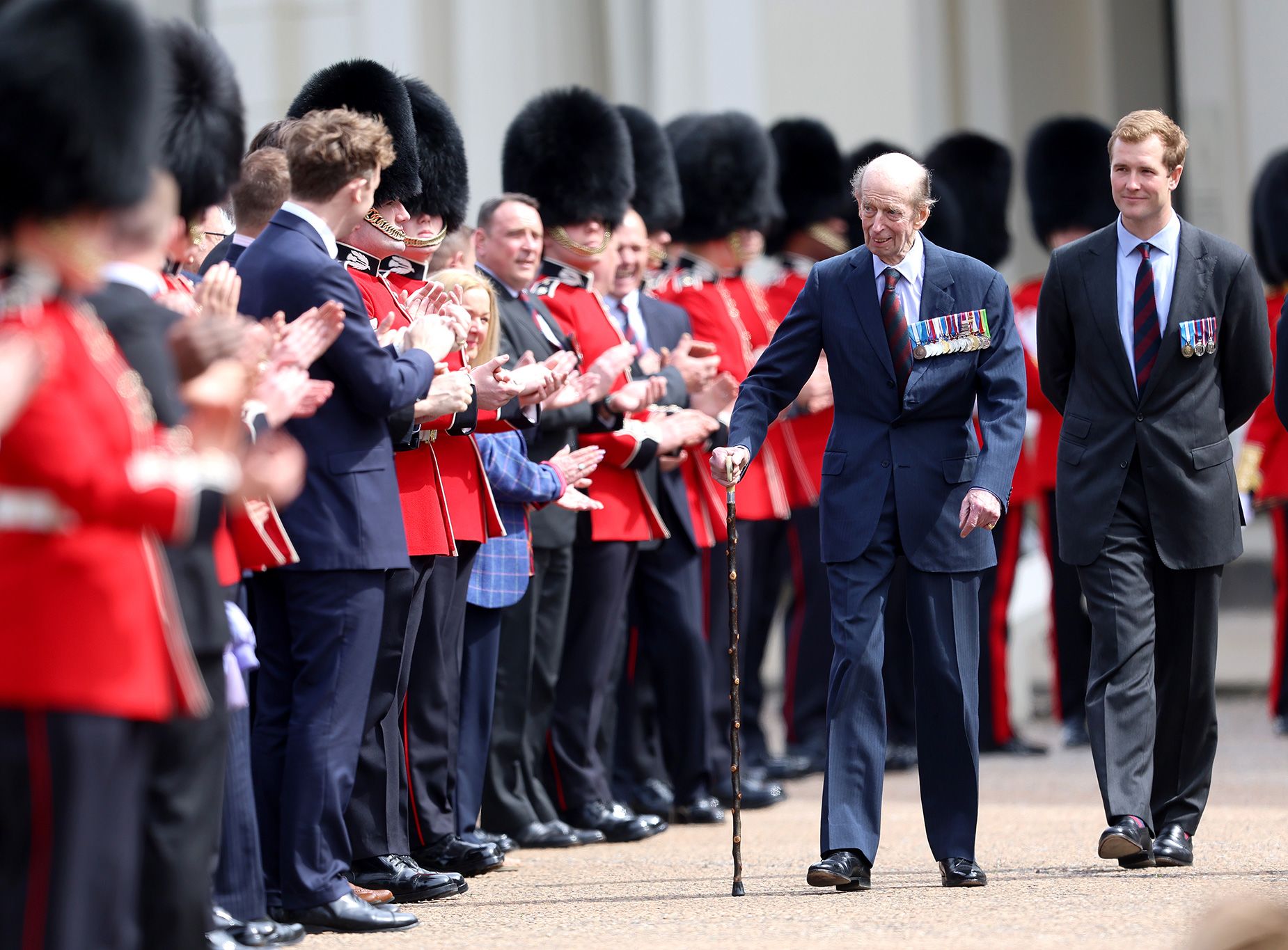 Prince Edward, Duke of Kent walks past members of the Scots Guards regiment 