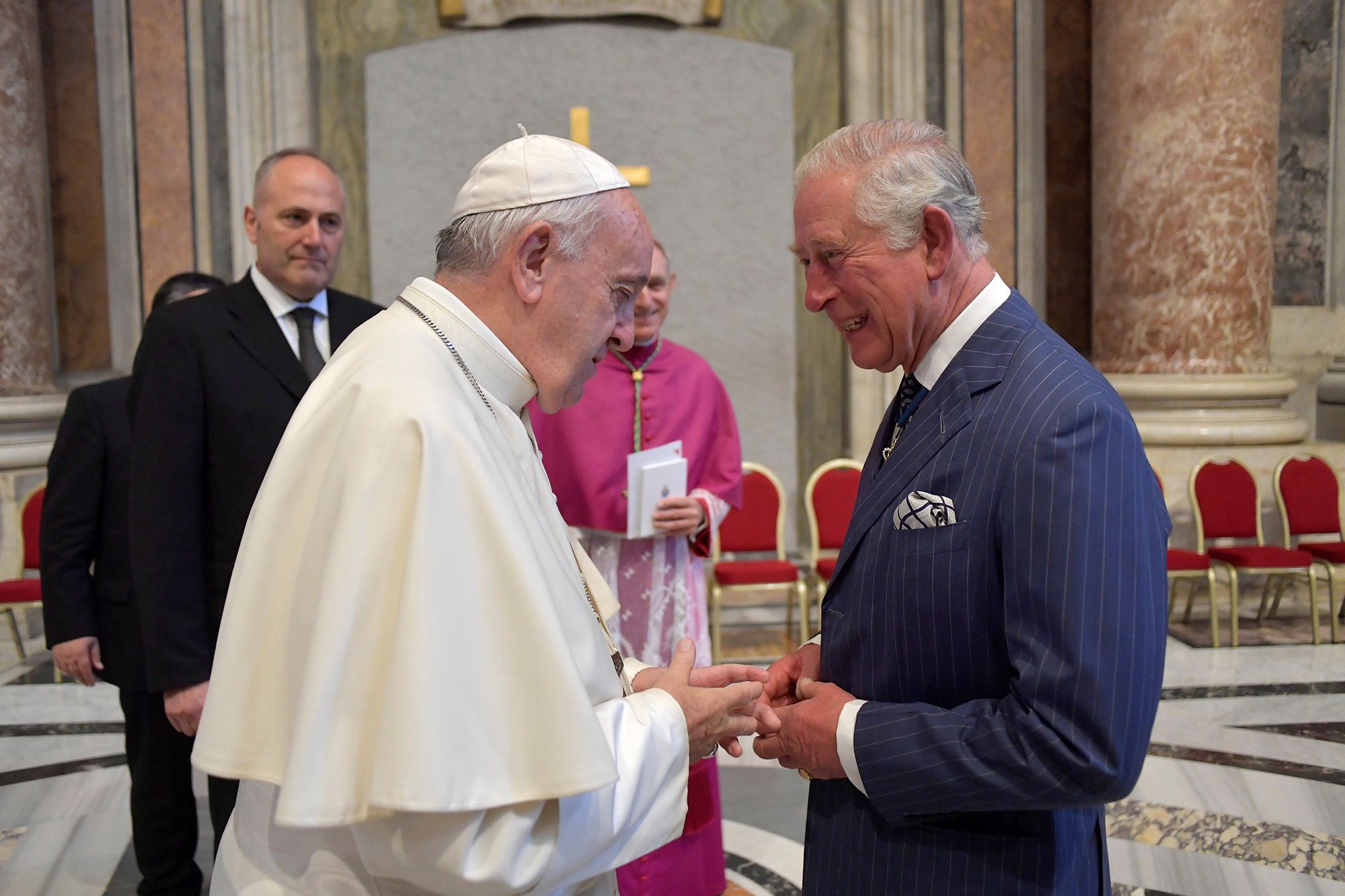 Pope Francis speaks with Britain's Prince Charles