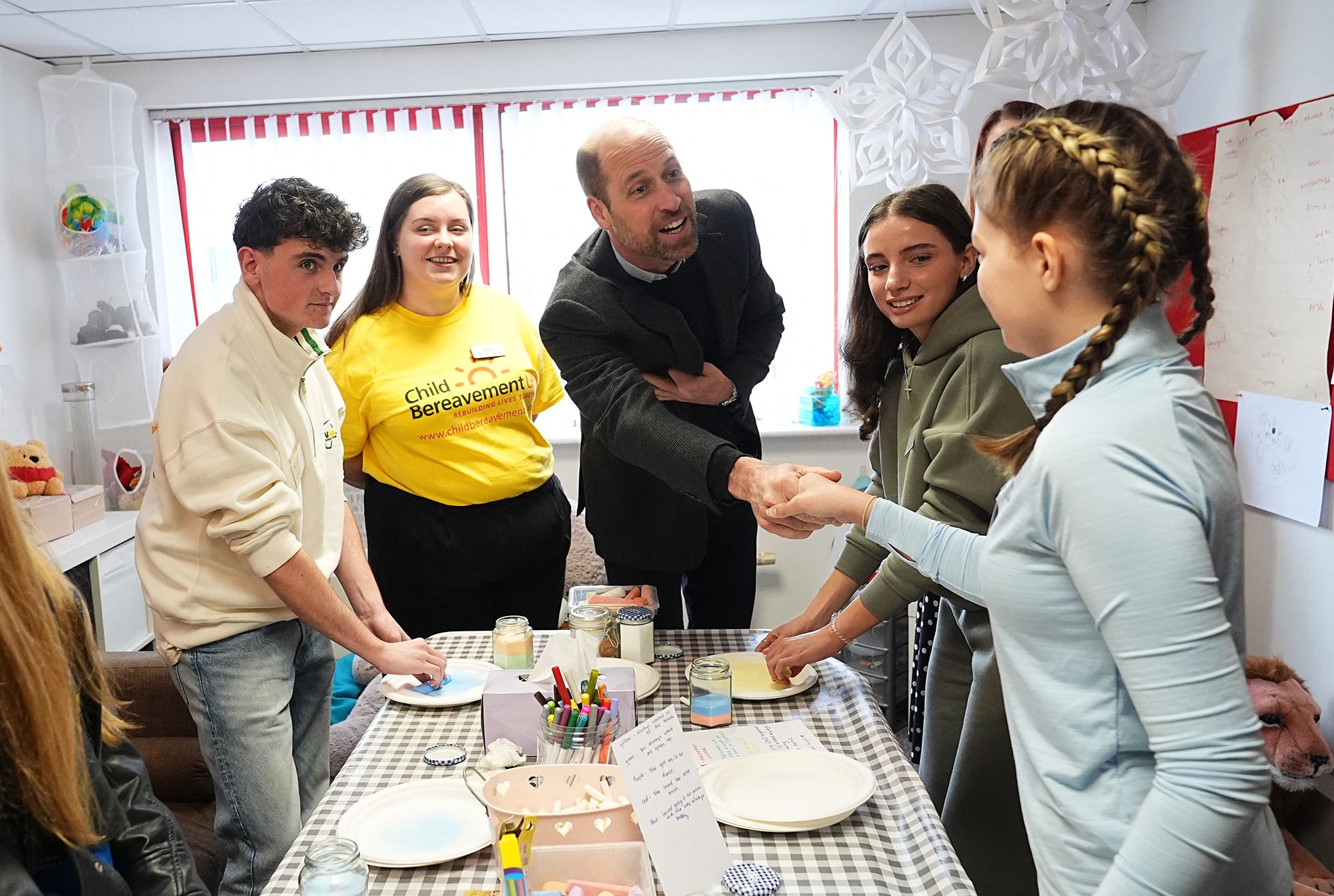 Photo of Prince William chatting with children who have been supported by the Child Bereavement UK charity