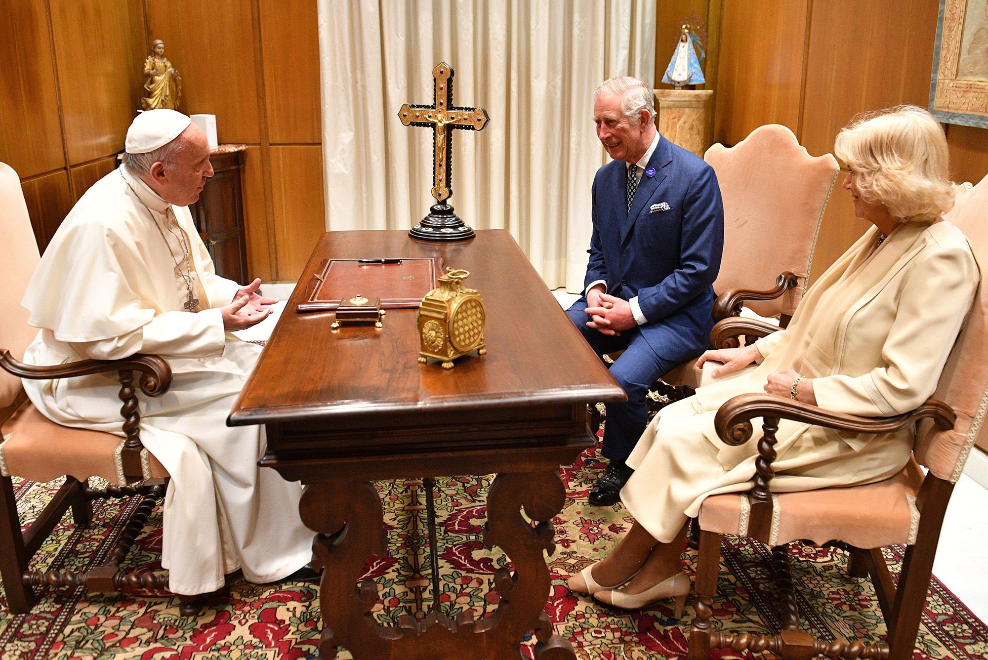 Photo of Pope Francis chatting with King Charles and Queen Camilla