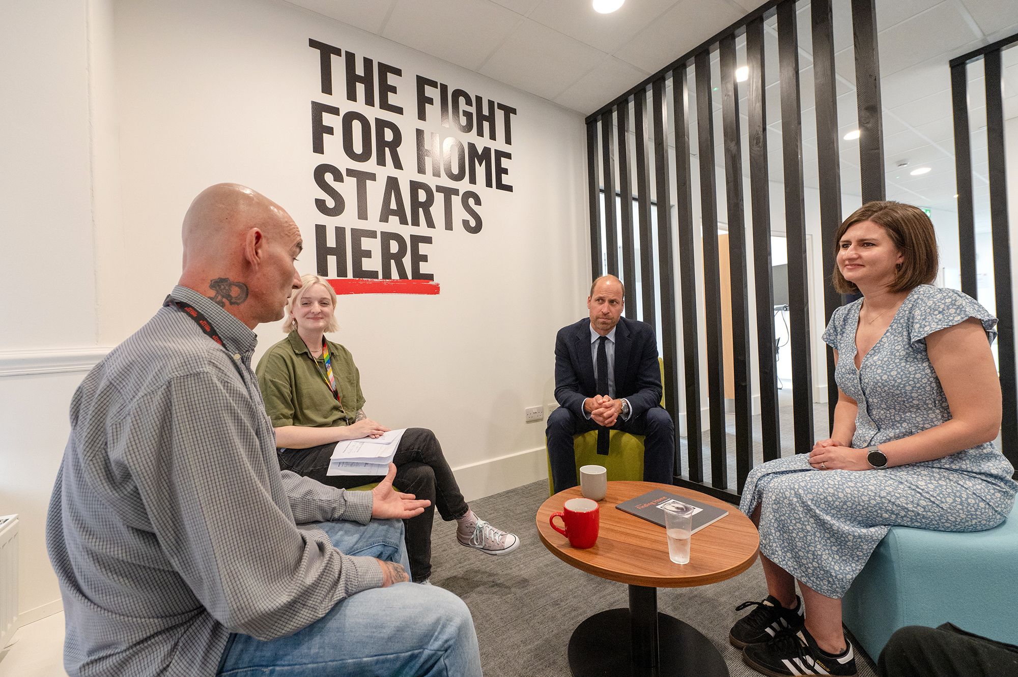 Prince William speaking to charity workers 