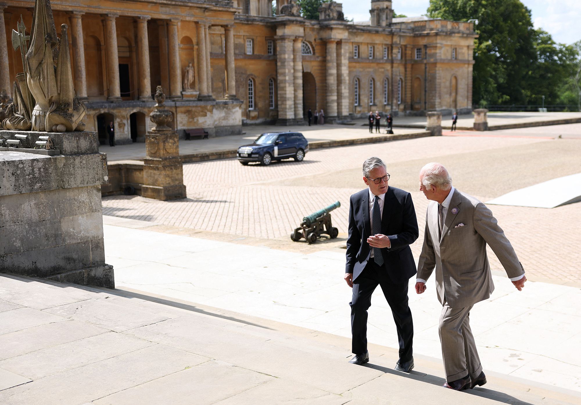 Photo of King Charles walking with Britain's Prime Minister Keir Starmer