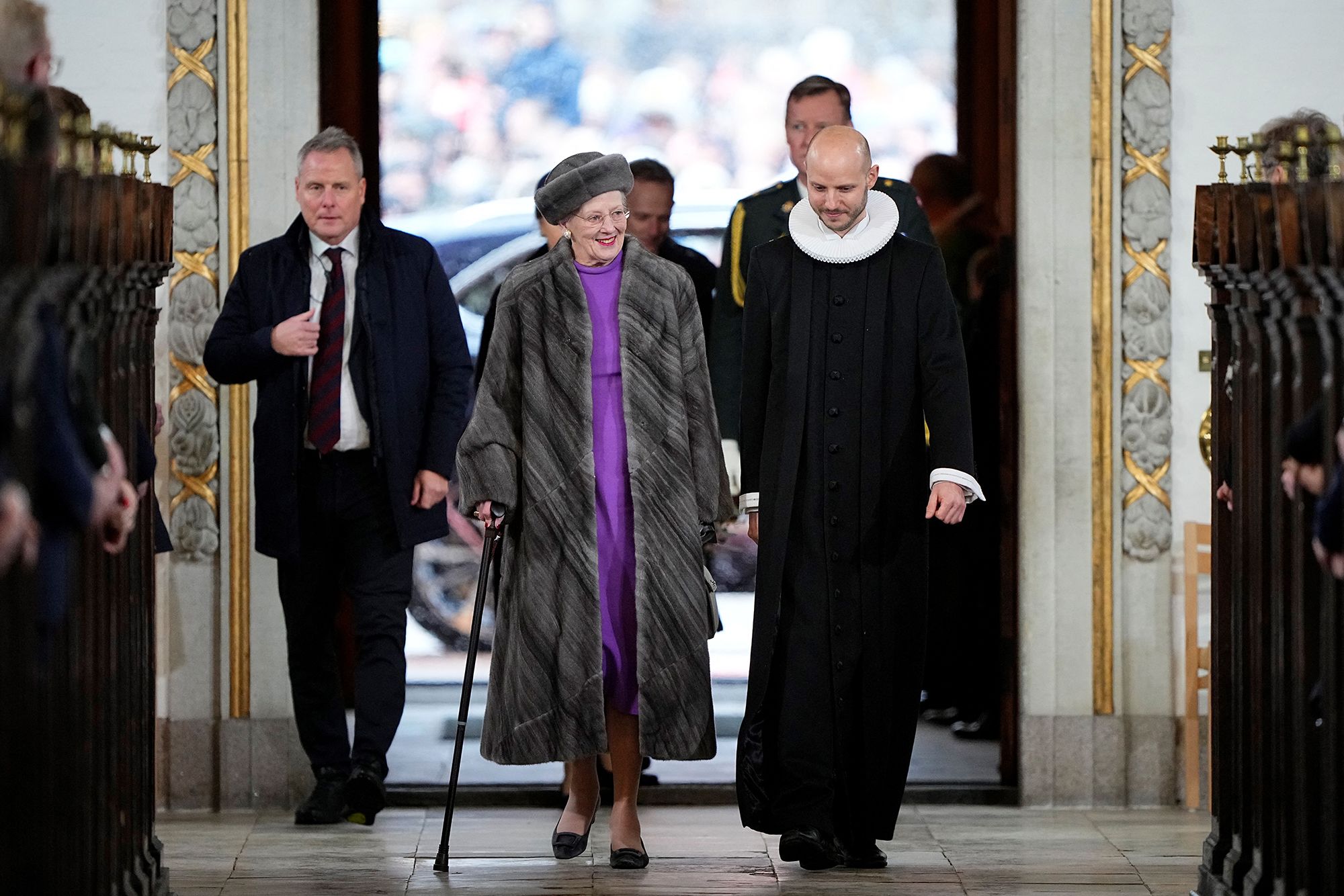 Queen Margrethe walking with stick