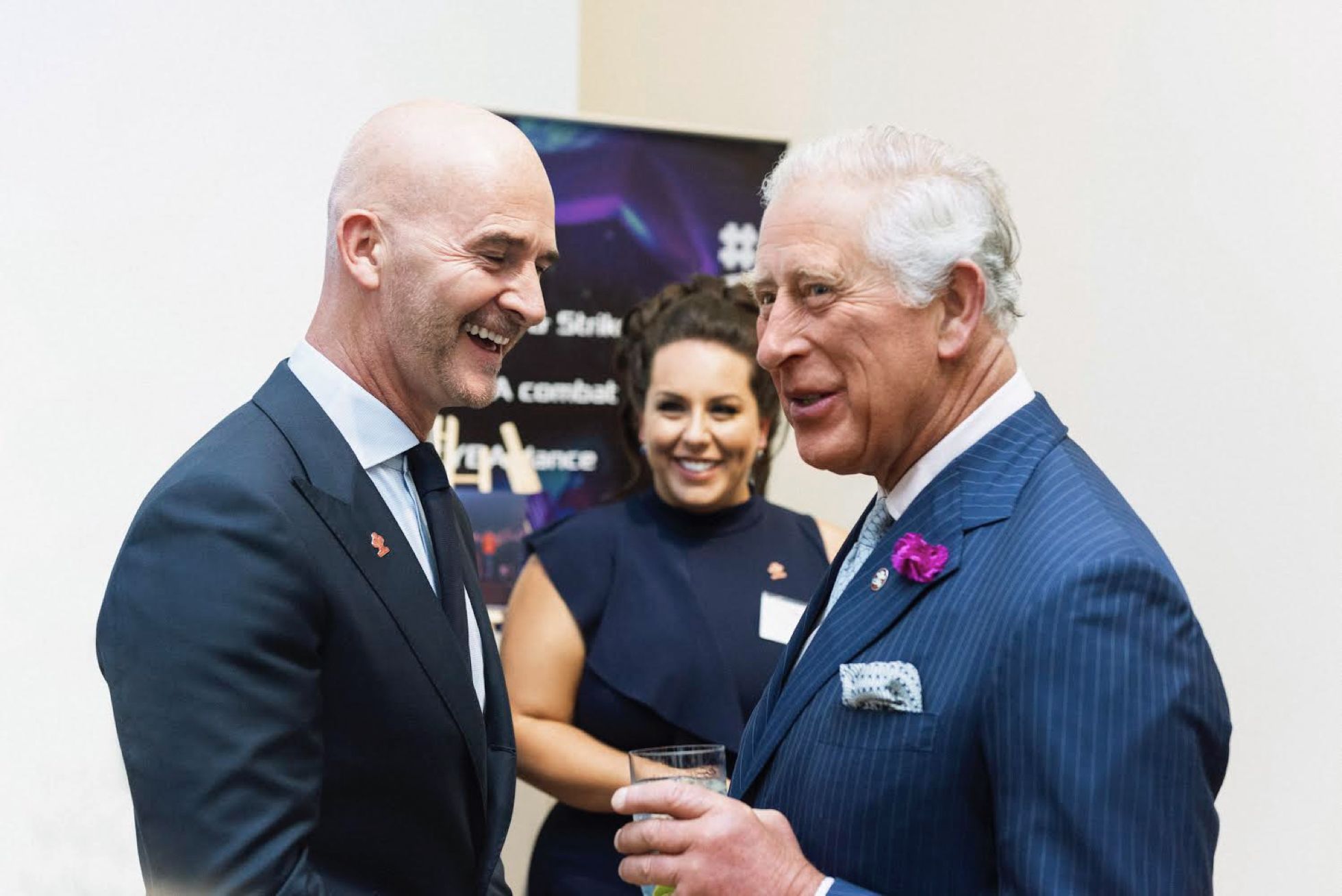 Photo of King Charles laughing with James Sommerville OBE