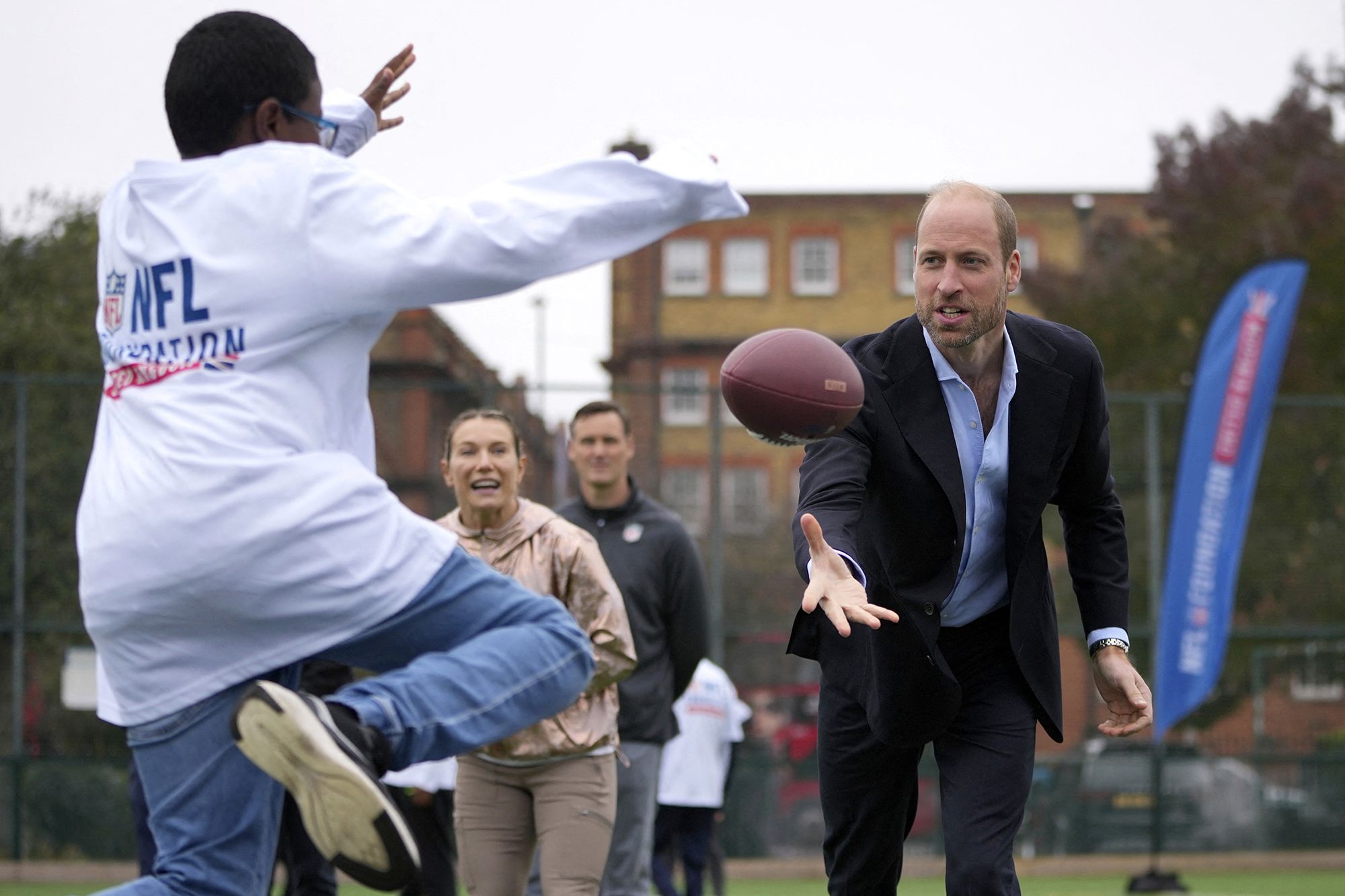 Prince William throwing a football