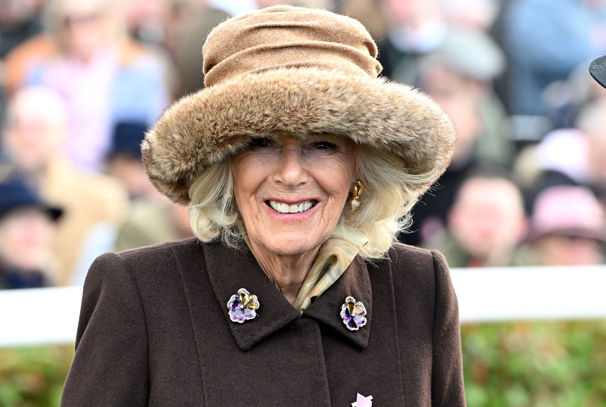 Photo of Queen Camilla smiling during a visit to Cheltenham Festival