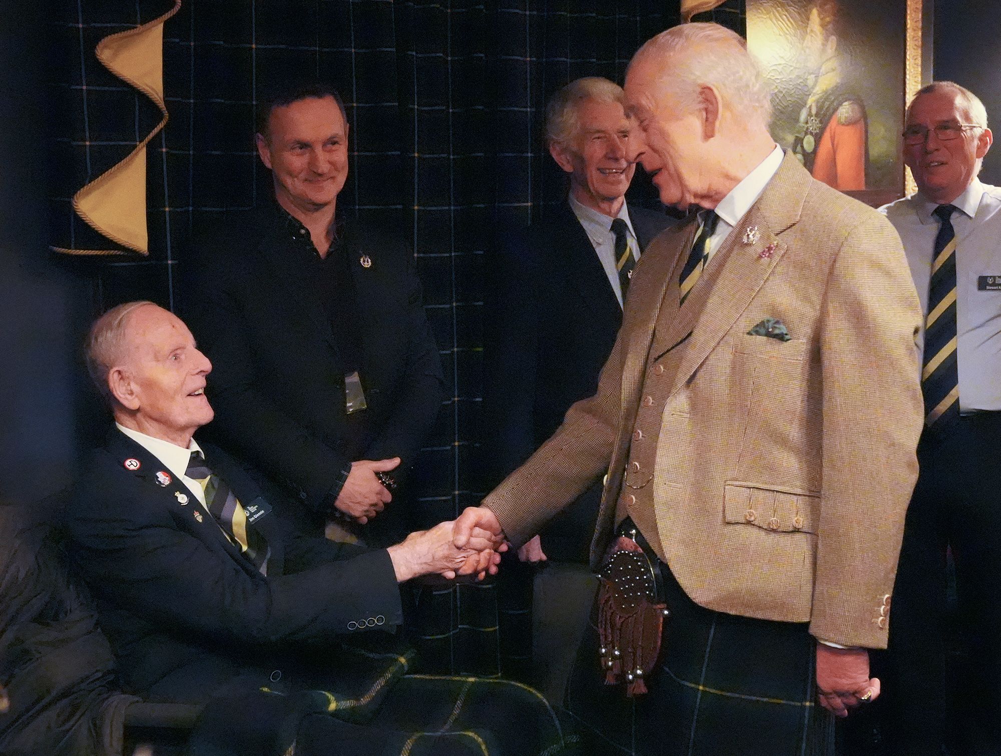 Photo of King Charles shaking hands with D-Day veteran Jim Glennie