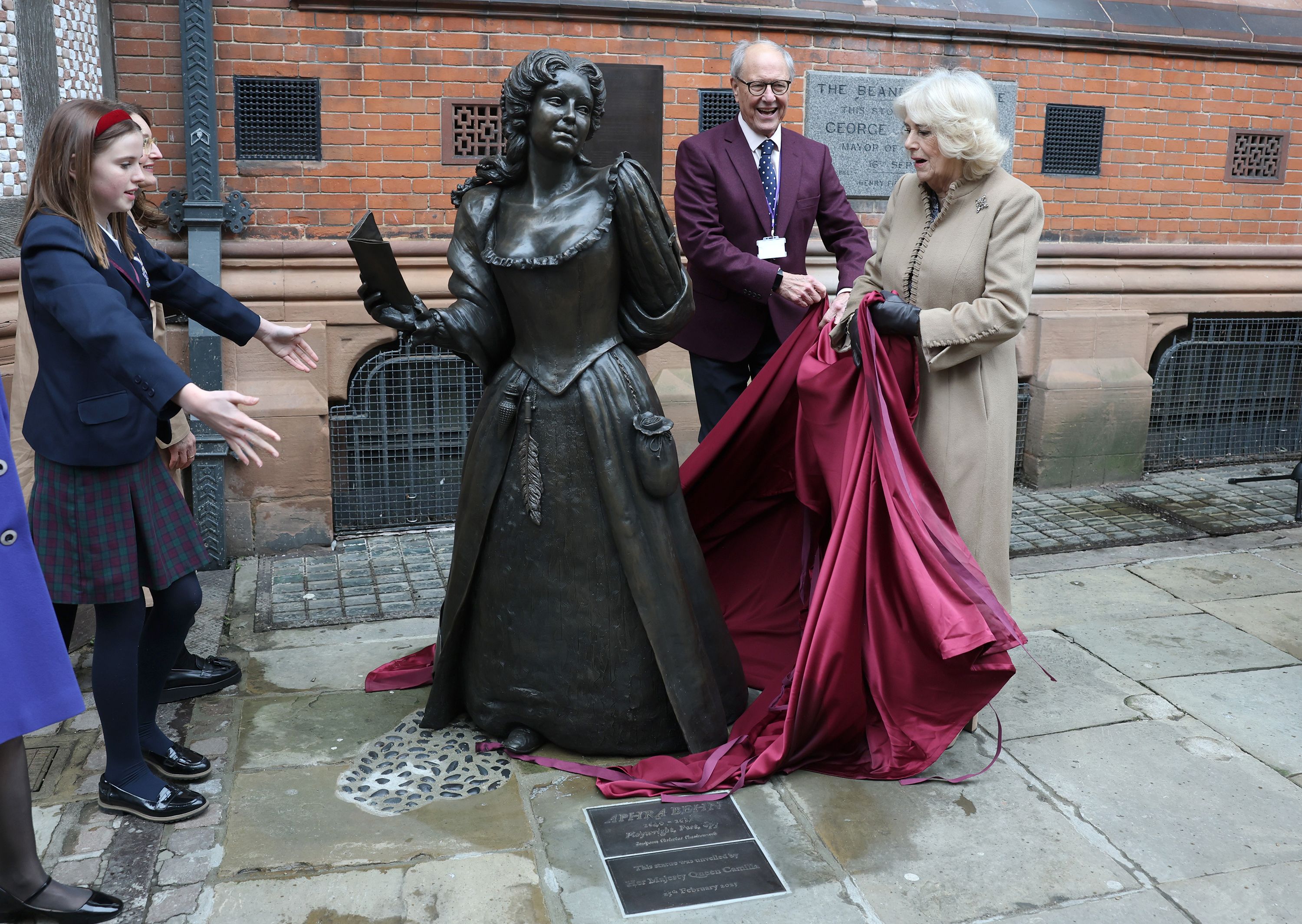 Queen Camilla unveils a bronze statue of Aphra Behn