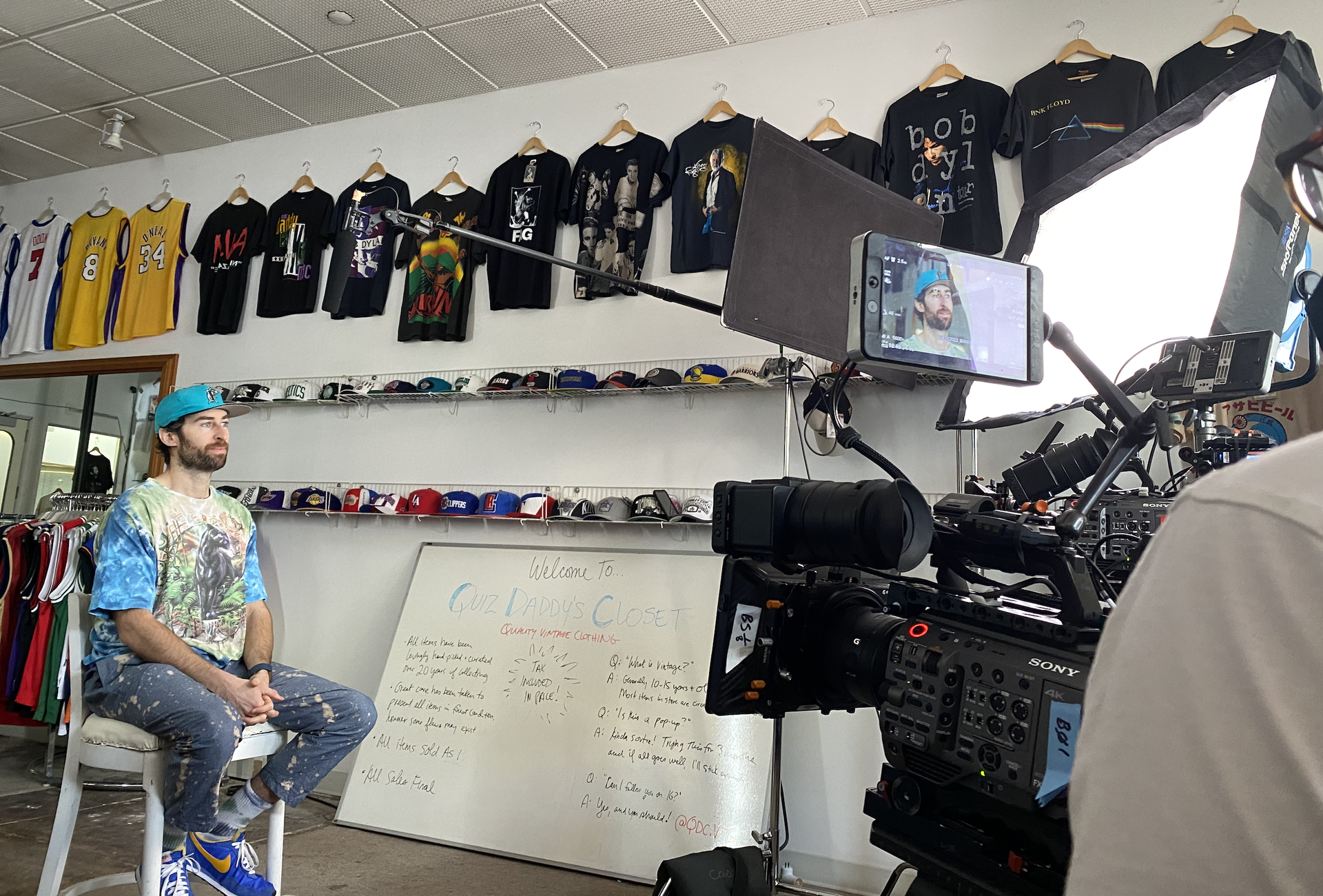 Scott Rogowsky, former host of HQ Trivia on set in his store, Quiz Daddy’s Vintage Closet in LA.