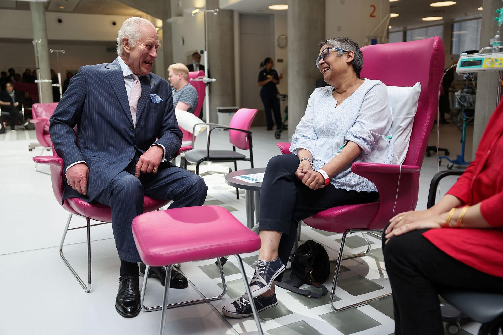 King Charles meets with patient Asha Millan during a visit to the University College Hospital Macmillan Cancer Centre in London, on April 30.