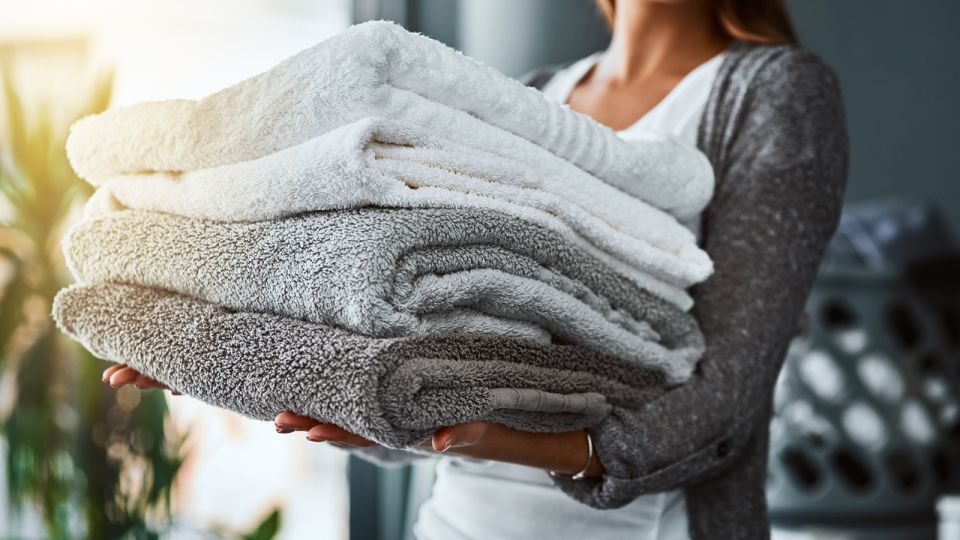 Person carrying towels