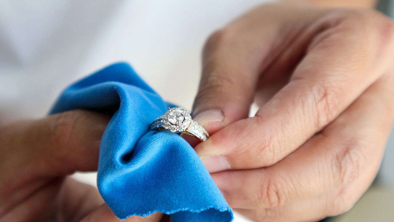 Person cleaning an engagement ring
