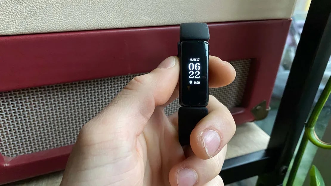 Person holding a Fitbit