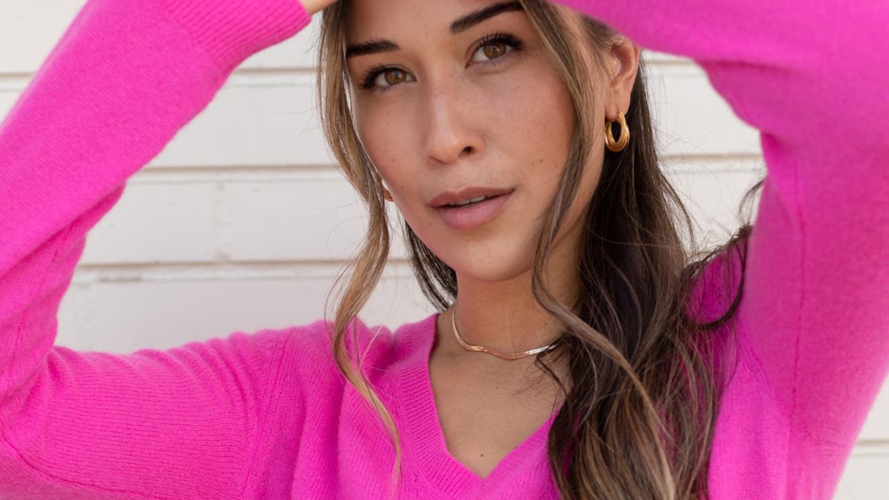 Person wearing bright pink sweater
