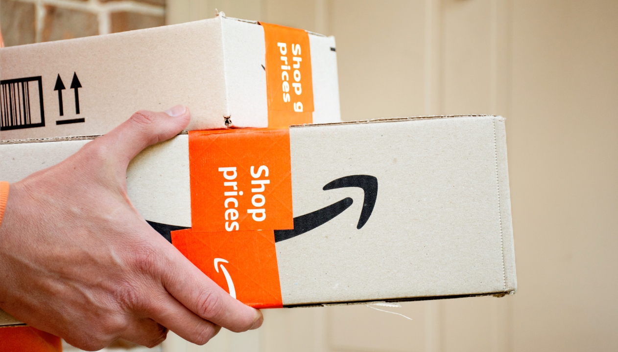 Person carrying Prime boxes