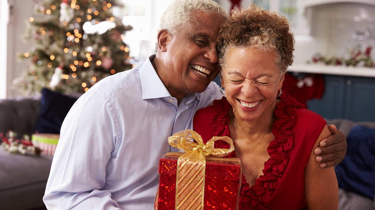 Mature couple exchanging gift