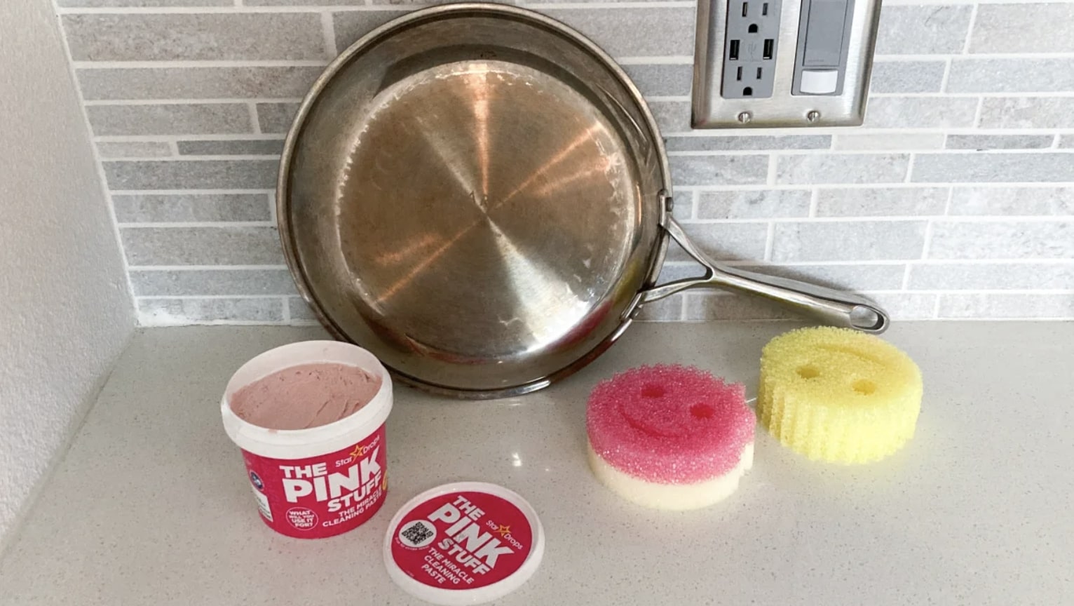 Stainless steel pan, two Scrub Daddy sponges and The Pink Stuff