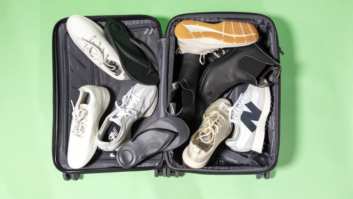 Variety of shoes in an open suitcase