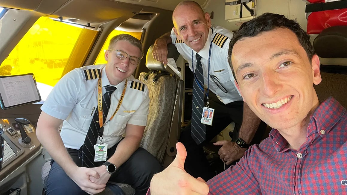 Three men in airplane cockpit