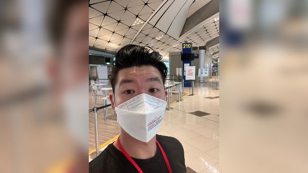 Traveler Darryl Chan waits for his coronavirus test results at Hong Kong airport on December 19, 2021.