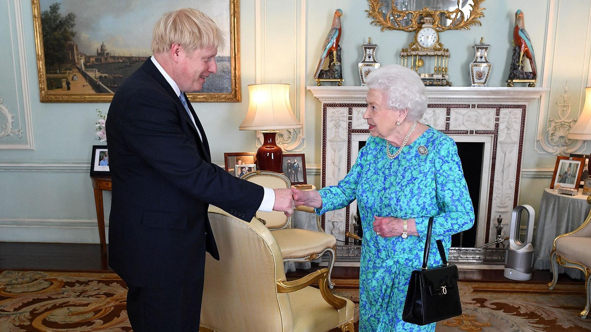 Boris Johnson, pictured here with Queen Elizabeth II in 2019, served the late monarch as her prime minister for three years.